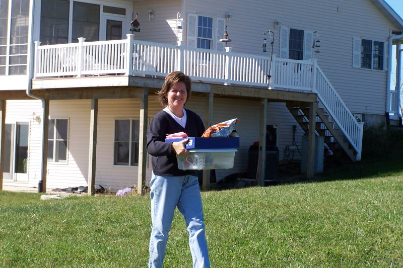 Laurie, XYL of KA9FOX, brings out soup, sandwiches and munchies for the hungry hams.