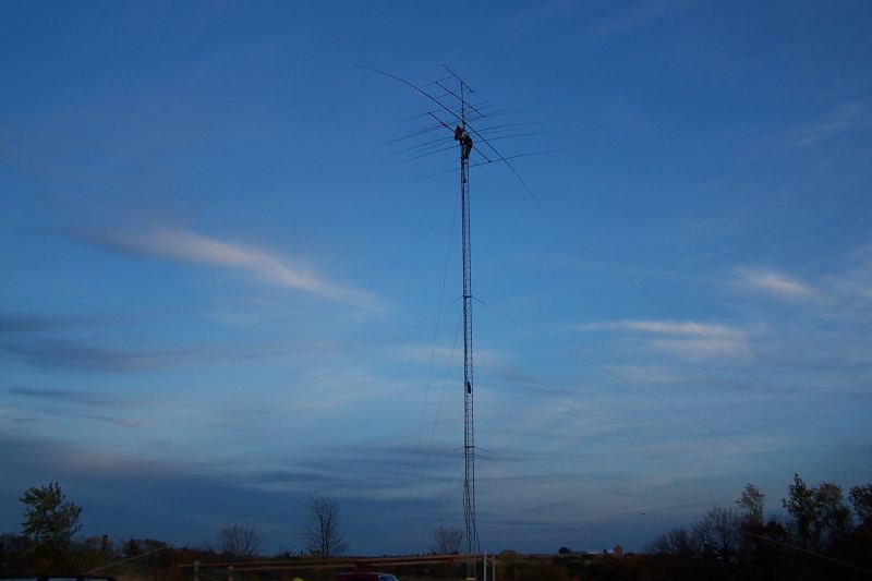 Getting dark out! WØAIH and KC9DGP making last minute adjustments to beams.