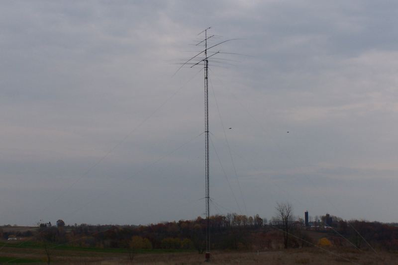 Tower and antennas,with feedline properly dressed down the side of the tower. 160m vee not installed yet.