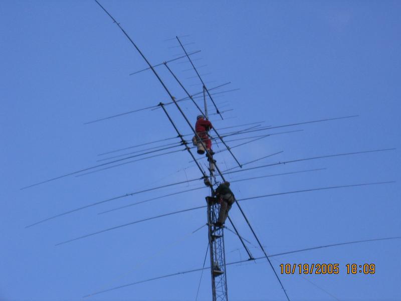 TOP: Paul WØAIH fixes element 3 on 6m beam that was knocked out of position, with Chris KC9DGP below. (Photo by WA9HC
