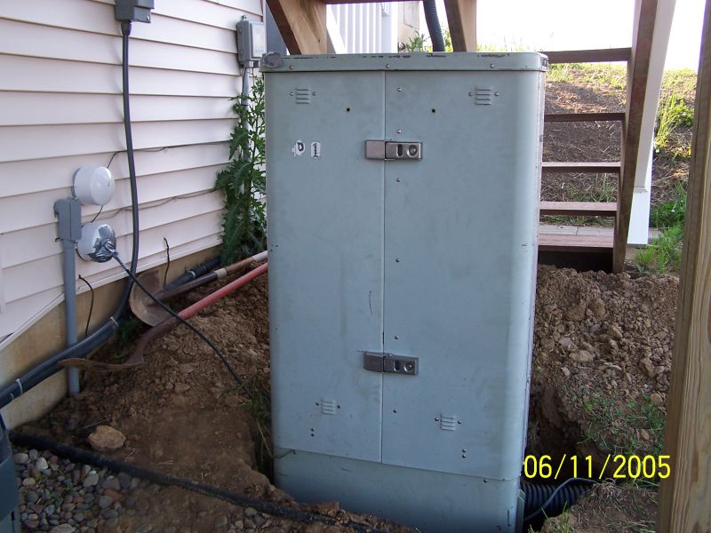 View of front of the cable box, which is telephone company surplus. 4 inch PVC pipes that go into the closet near the radio room