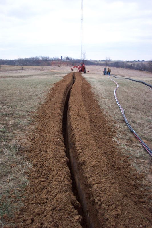 Trench was about 3 feet deep.  Trenching was done on December 16th, 2004, perhaps a day or two before the ground froze.
