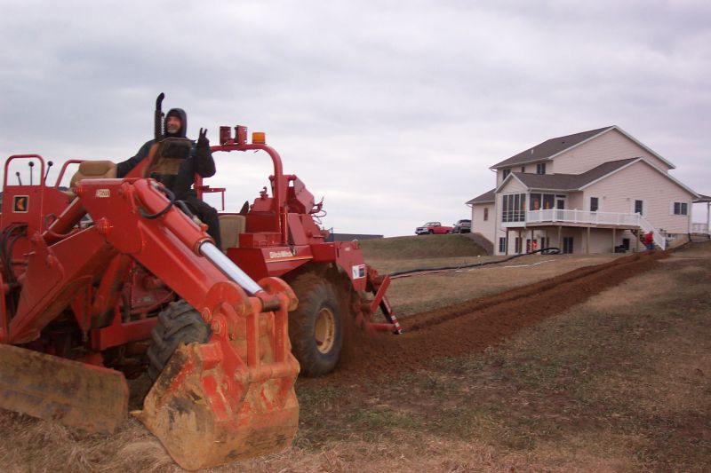 My friend Gary from the phone company doing the trenching thing.