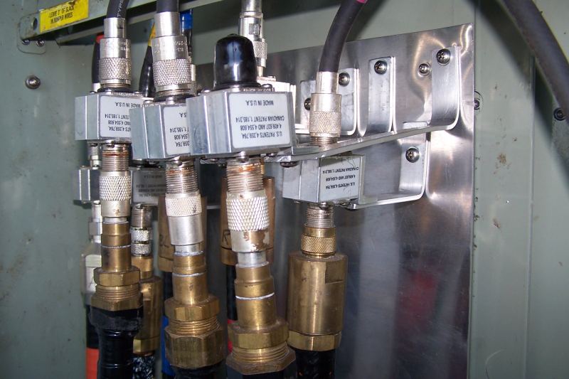 Closeup of PolyPhasers mounted to aluminum sheet.  Back row is all the 7/8" Andrew, and the front row is the 3/4" CATV