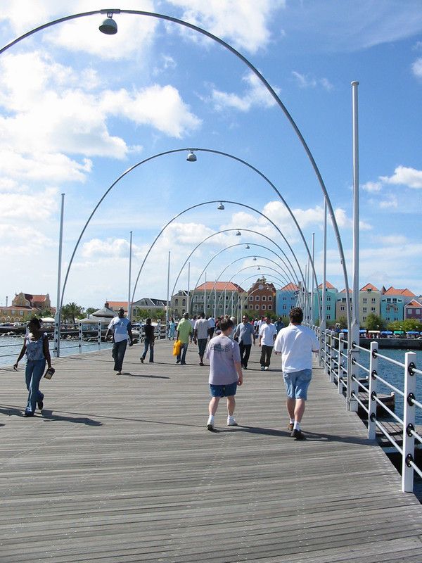 Scott and Mike walking across the Queen Emma Pontoon Bridge 
