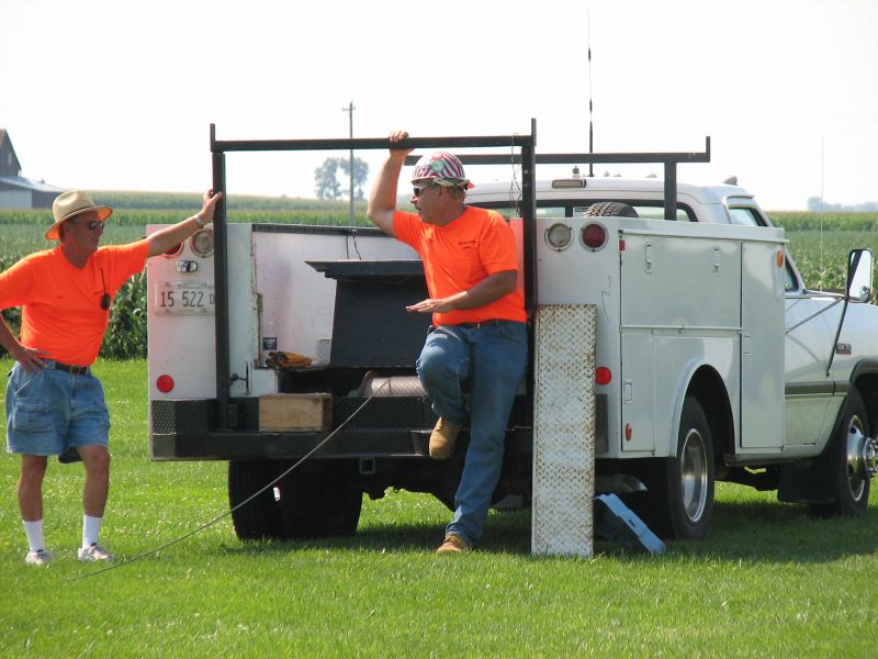 Jim Ward on the left and WB9Z on the
right discussing the "easy" installation
of the 40 meter yagi.  It sure helps t