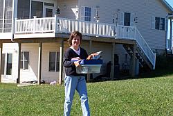 Laurie, XYL of KA9FOX, brings out soup, sandwiches and munchies for the hungry hams.