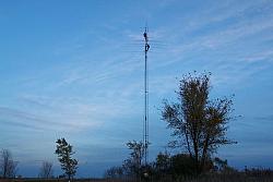 Almost done!  Paul WØAIH is straightening out the 80m dipole.