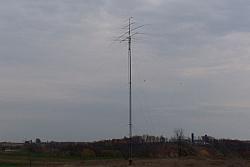 Tower and antennas,with feedline properly dressed down the side of the tower. 160m vee not installed yet.