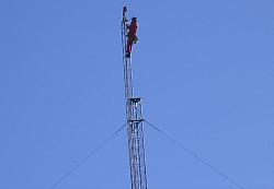 Paul WØAIH on the Gin Pole. (pic courtesy WA9HCZ)