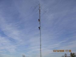 Paul WØAIH (top) and Chris KC9DGP (bottom) ride up the tower on the Gin Pole rope. (pic courtesy WA9HCZ)