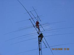 TOP: Paul WØAIH fixes element 3 on 6m beam that was knocked out of position, with Chris KC9DGP below. (Photo by WA9HC