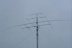 You can see 160m inverted vee hanging on left side of tower. Feedline juts out just above the rotor.