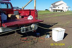 W0AIH's truck with his 220v winch attached to his hitch receiver.  Used this to pull up the tower sections.