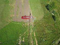 Picture of tower crew from above.  Nice shadow of the tower cast upon them.