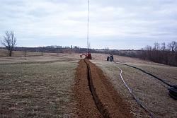 Trencher almost done with 300 foot long trench, which will contain 8 runs of hardline, 3 runs of three conductor direct bury ele