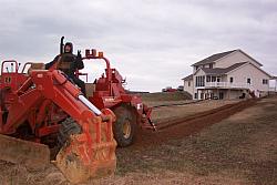 My friend Gary from the phone company doing the trenching thing.