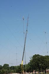 A nice picture of John W2GD and Don K4ZA installing the tall 15  7 ele OWA atop the 20 stack (@199')....